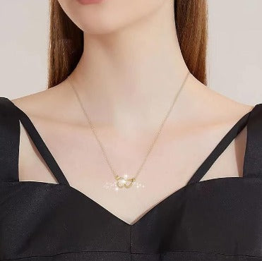 Collar de doble anillo de corazón dorado